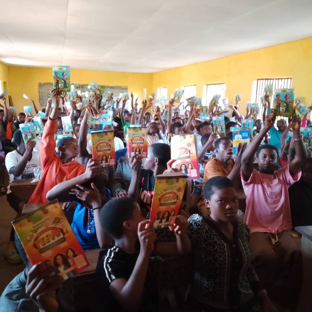 Students holding Rhapsody publications in a classroom